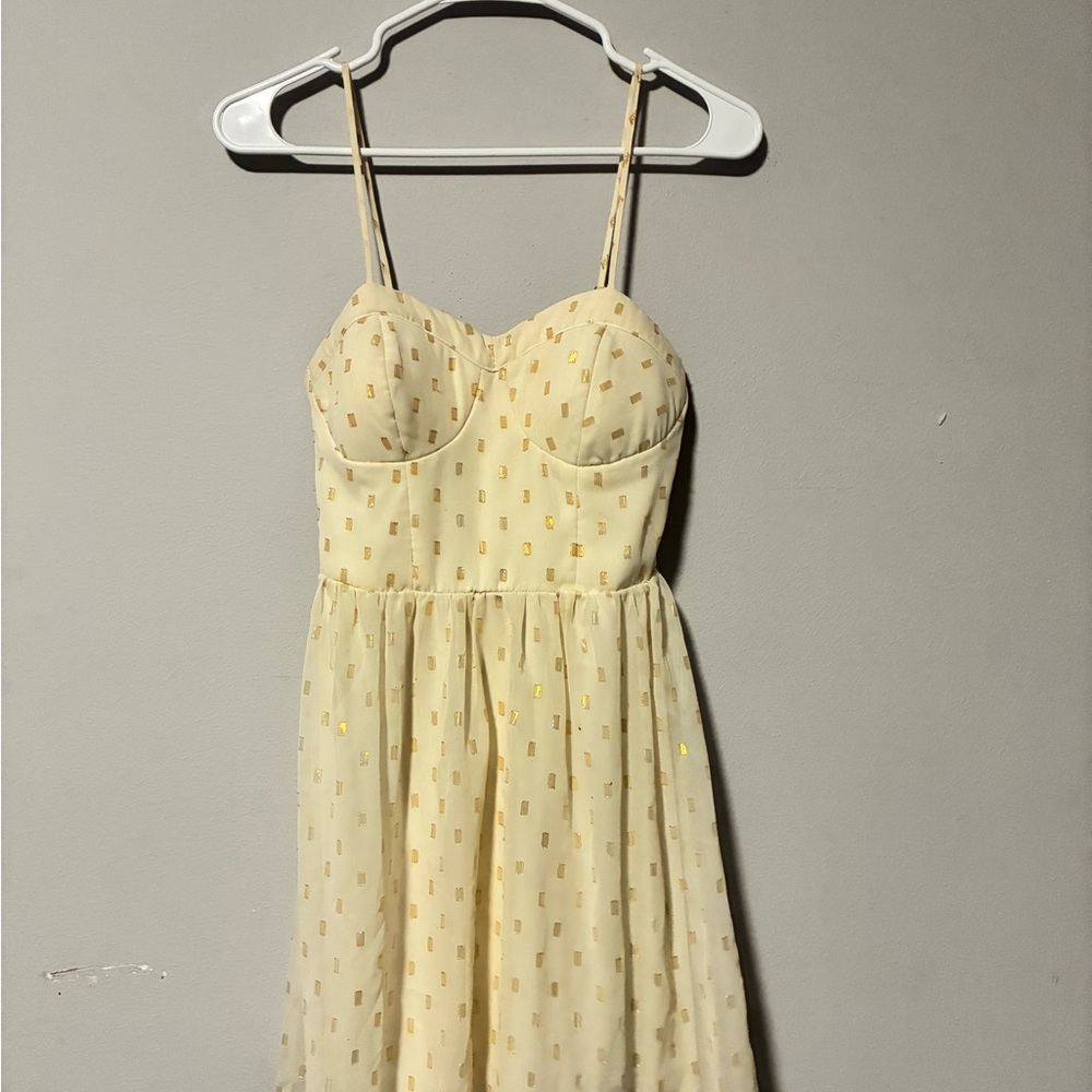No Boundaries Pale Yellow Spaghetti Strap Mini Dress with Gold Accents